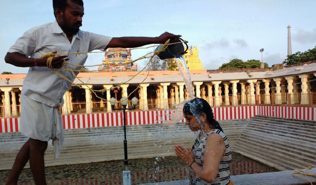 Devotees taking bath at 22 Wells in Rameshwaram Temple